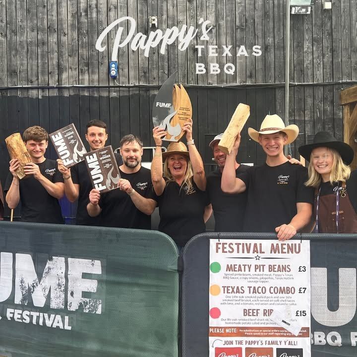 Custom wooden and acrylic award enlarged to 60 cm with a metal flame element, designed by TakeAwards for the Fume Barbecue Festival in London, alongside personalized diplomas with metal fire details.