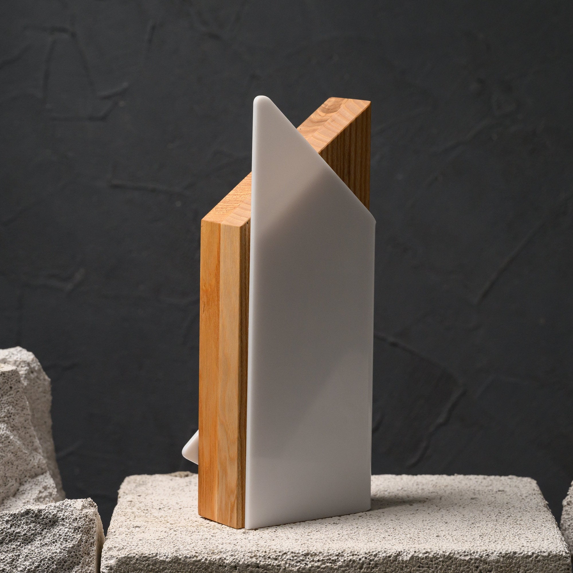 Rear profile of the award, where the white acrylic panel stands proud of the solid oak block