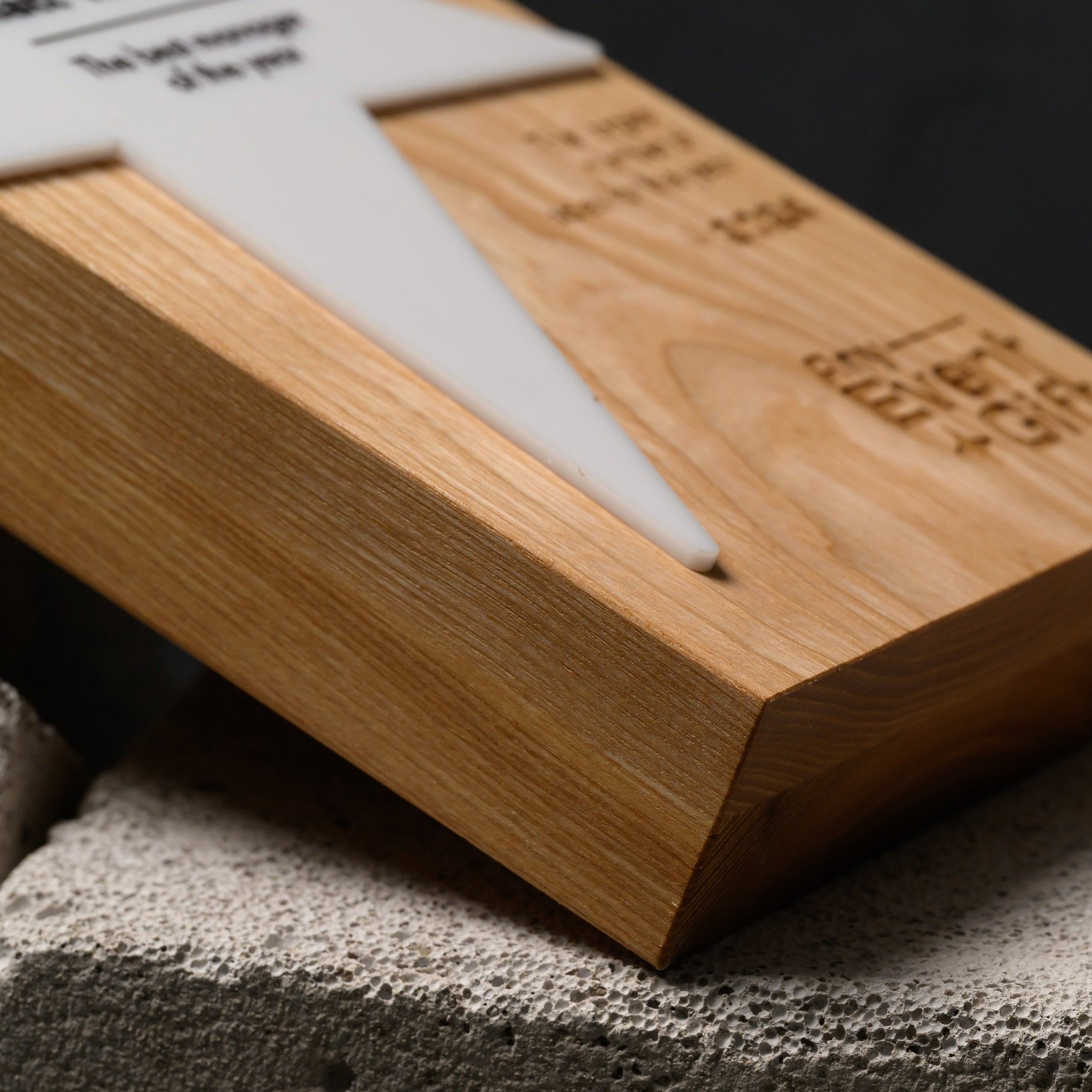 Angled view of the oak star award showing the raised acrylic star and the depth of the block