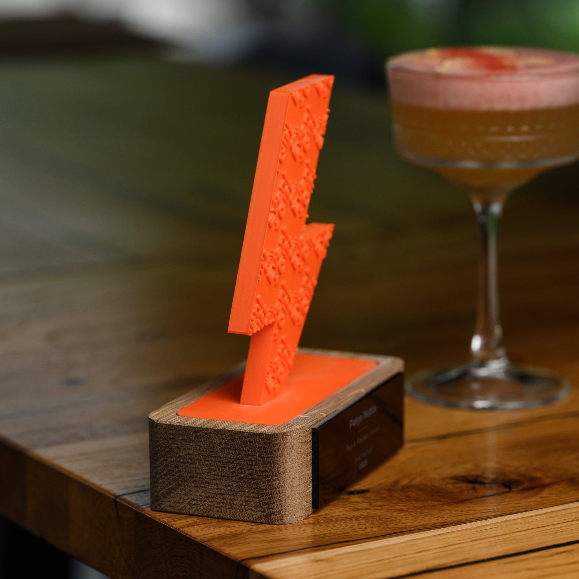 Side angle of the printed figure showing its thickness and the colour-matched seat in the oak base
