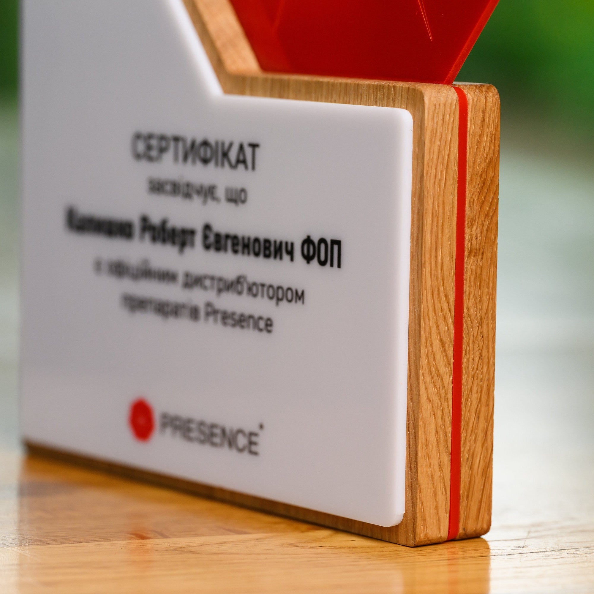 Low-angle view along the foot of the plaque, showing the thickness of the layered construction