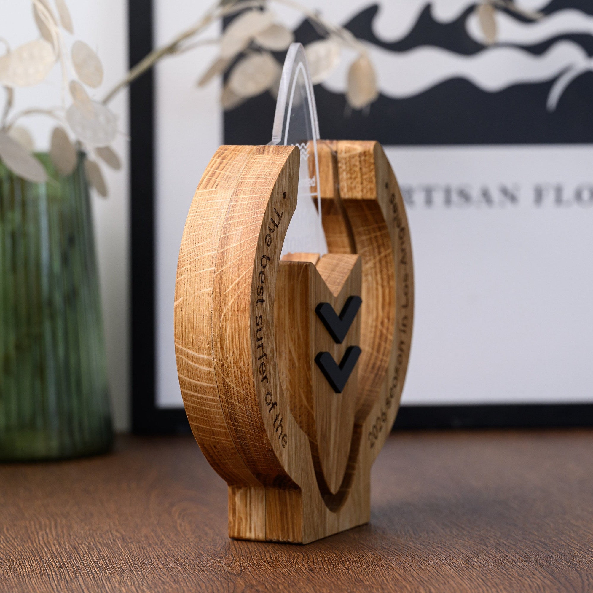 Side profile of the surf trophy revealing the layered oak frame thickness and recessed acrylic board